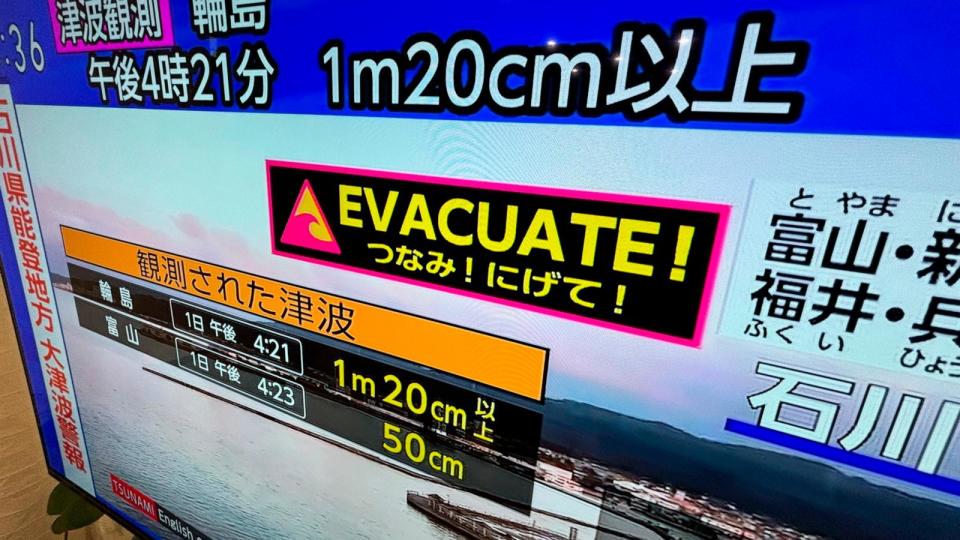 PHOTO: A tsunami warning is shown on TV in Yokohama, near Tokyo, Monday, Jan. 1, 2024.  (Eugene Hoshiko/AP)