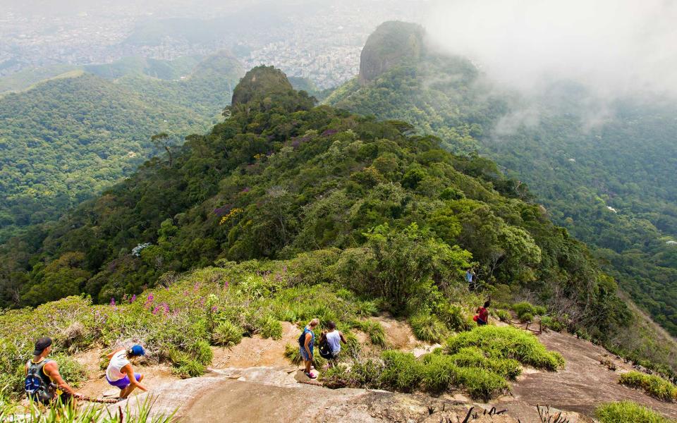 <p>Those looking to escape the bustling city will love <a rel="nofollow noopener" href="http://www.travelandleisure.com/travel-guide/rio-de-janeiro/things-to-do/tijuca-national-park" target="_blank" data-ylk="slk:Tijuca National Park;elm:context_link;itc:0;sec:content-canvas" class="link ">Tijuca National Park</a>. It’s one of the largest urban rainforest in the world and is filled with luscious plants, waterfalls, and booming with wildlife. Many decide to venture into the park to visit the Christ the Redeemer statue, but the forest has much more to offer. Choose to explore the many hiking trails and picnic areas. Those looking for thrills can opt for cycling, paragliding, and rock climbing. </p>