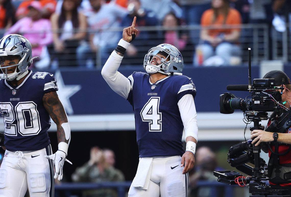 Dallas Cowboys quarterback Dak Prescott reacts after throwing a touchdown pass against the Chicago Bears on Sunday, October 30, 2022, at AT&T Stadium in Arlington.