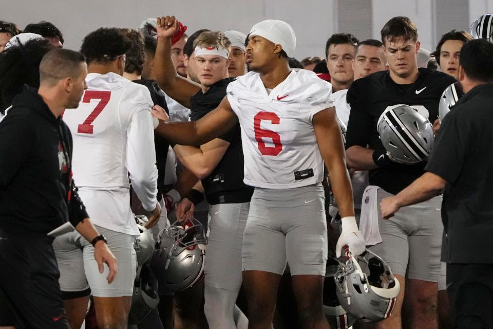 Ohio State linebacker Sonny Styles (6) huddles with teammates during spring practice.