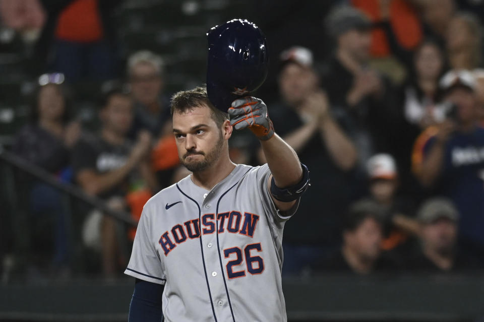 Houston Astros' Trey Mancini (26) waves to the crowd during a second-inning at-bat against the Baltimore Orioles in a baseball game Thursday, Sept. 22, 2022, in Baltimore. (AP Photo/Tommy Gilligan)