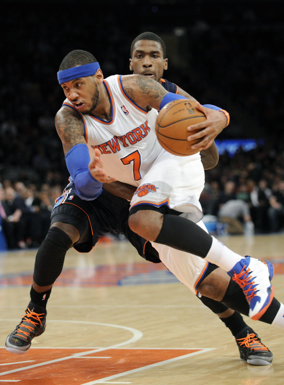 New York Knicks' Carmelo Anthony (7) drives by Charlotte Bobcats' Michael Kidd-Gilchrist during the second quarter of an NBA basketball game, Friday, Jan. 24, 2014, at Madison Square Garden in New York. Anthony scored 62 points as the Knicks defeated the Bobcats 125-96. (AP Photo/Bill Kostroun)