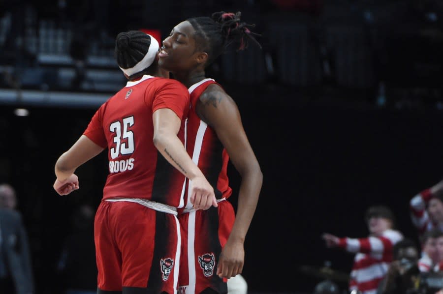 North Carolina State guard Zoe Brooks (35) and guard Saniya Rivers celebrate a shot against Texas during the first half of an Elite Eight college basketball game in the women’s NCAA Tournament, Sunday, March 31, 2024, in Portland, Ore. (AP Photo/Steve Dykes)