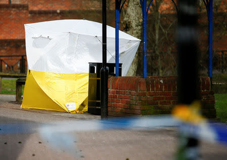 A tent covers the park bench where former Russian intelligence agent Sergei Skripal and his daughter Yulia were found after they were poisoned, in Salisbury, Britain. March 14, 2018. REUTERS/Henry Nicholls