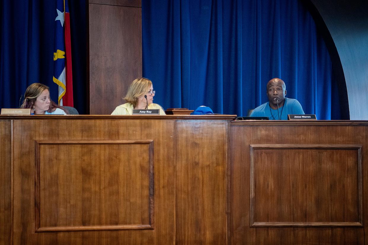 Asheville City School Board of Education members, from left, Liza Kelly, Amy Ray and Jesse Warren, June 29, 2023.