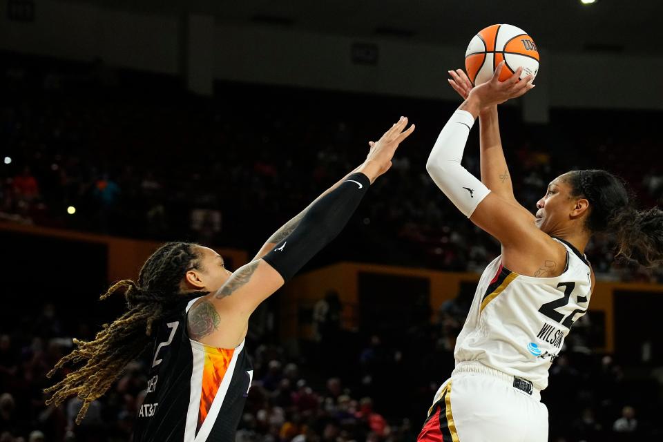 Las Vegas Aces forward A'ja Wilson (22) shoots over Phoenix Mercury center Brittney Griner during the second half of a WNBA basketball game, Sunday, Oct. 3, 2021, in Phoenix.