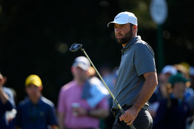 Scottie Scheffler putts during a practice round