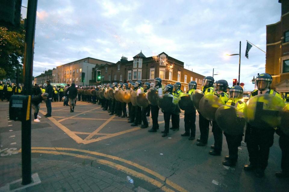 Riot police on the scene in Newham (PA)