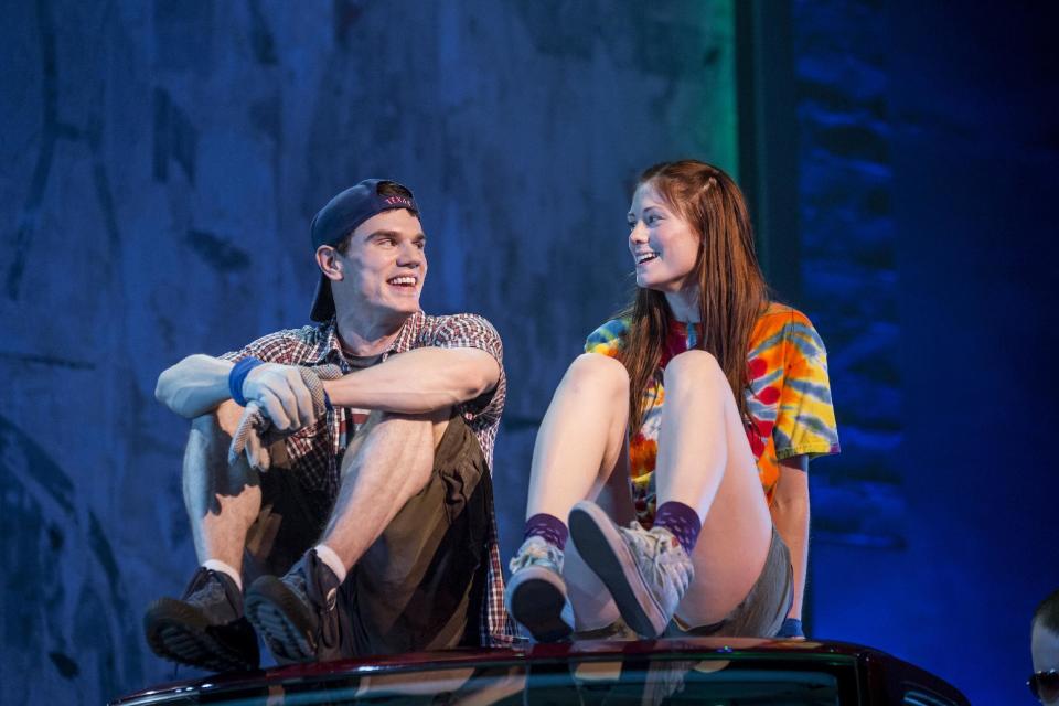 This theater image released by The Hartman Group shows Jay Armstrong Johnson, left, and Allison Case during a performance of "Hands on a Hard Body," at the Brooks Atkinson Theater in New York and featuring songs co-written by Phish frontman Trey Anastasio. (AP Photo/The Hartman Group, Chad Batka)