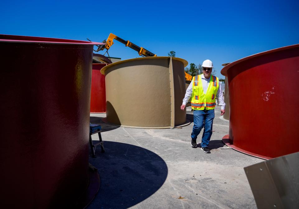 Jason Lasecki, vice president, walks among pieces of water slides at the Great Wolf Lodge South Florida site in Naples on Wednesday, Feb. 21, 2024.