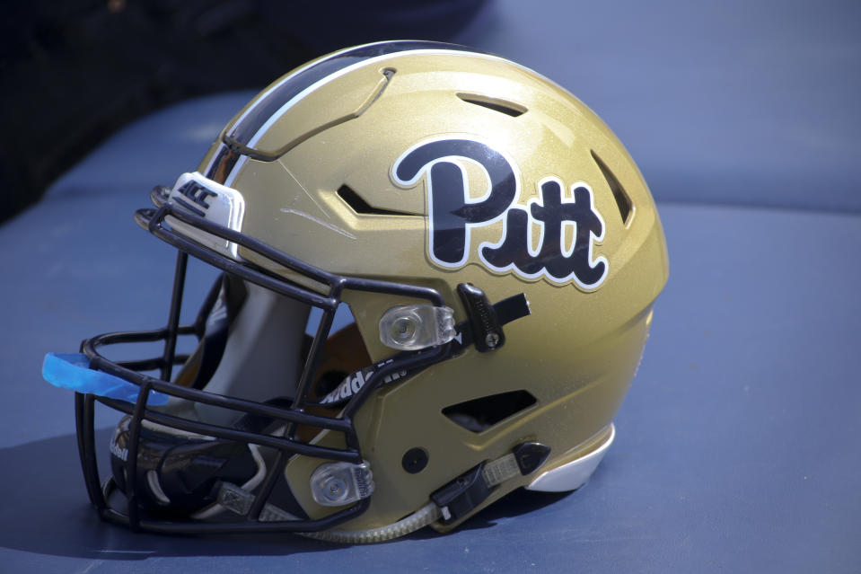 A Pittsburgh football helmet with the "Pitt" script is on a training table during the annual Pittsburgh Spring NCAA football scrimmage, Saturday, April 15, 2017, in Pittsburgh. (AP Photo/Keith Srakocic)