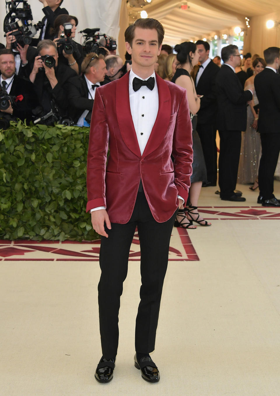 <p>Clad in a red velvet jacket, the ‘Spiderman’ actor made his sartorial prowess known. <em>[Photo: Getty]</em> </p>