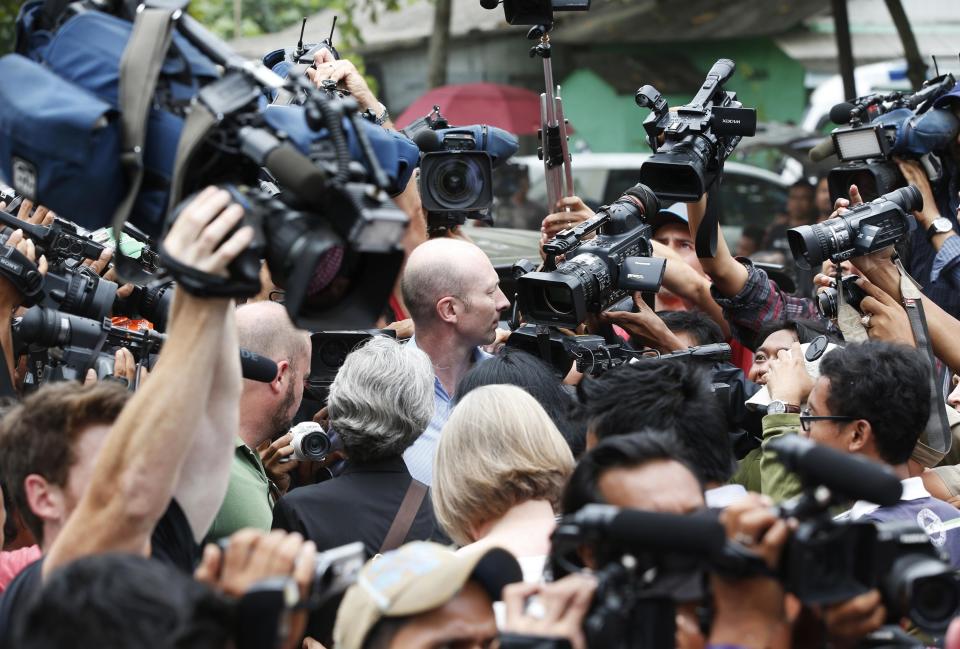 Australian embassy officials accompanied by the legal team for two Australian death row prisoners arrives back by ferry from the prison island of Nusakambangan, where upcoming executions are expected, in Cilacap, Central Java March 7, 2015. The planned executions of Myuran Sukumaran, 33, and Andrew Chan, 31, have ramped up diplomatic tension between Australia and Indonesia after repeated pleas for mercy on their behalf. They are among a group of up to 11 convicts, mostly foreigners, due to be executed soon on the prison island of Nusakambangan. REUTERS/Darren Whiteside (INDONESIA - Tags: CRIME LAW POLITICS)