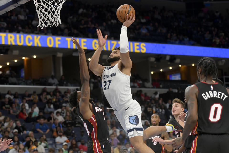 Memphis Grizzlies forward David Roddy (27) shoots against Miami Heat forward Haywood Highsmith, left, in the second half of a preseason NBA basketball game Friday, Oct. 7, 2022, in Memphis, Tenn. (AP Photo/Brandon Dill)