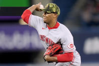 Cincinnati Reds starting pitcher Hunter Greene (21) works against the Toronto Blue Jays during the first inning of a baseball game in Toronto, Saturday, May 21, 2022. (Frank Gunn/The Canadian Press via AP)