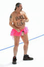 <p>A shirtless man clad in a tutu dances on the rink following the men’s 1,000m speed skating event medal ceremony during the Pyeongchang 2018 Winter Olympic Games at the Gangneung Oval in Gangneung on February 23, 2018. / AFP PHOTO / Roberto SCHMIDT </p>