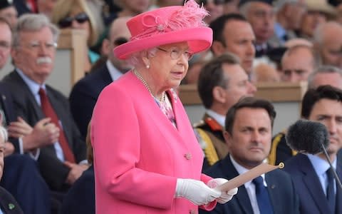  Queen Elizabeth II stands to make her address during an event to commemorate the 75th anniversary of the D-Day landings - Credit: AFP