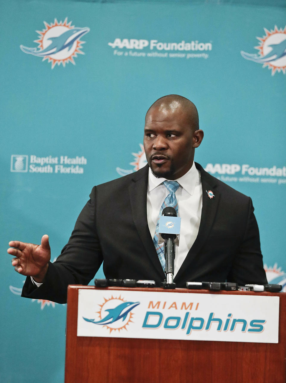 The new Miami Dolphin's head coach Brian Flores speaks during a news conference on Monday, Feb. 4, 2019, in Davie, Fla. Hours after his team won the Super Bowl, New England Patriots linebackers coach Flores has been hired as head coach of the Miami Dolphins. They decided on Jan. 11. (AP Photo/Brynn Anderson)