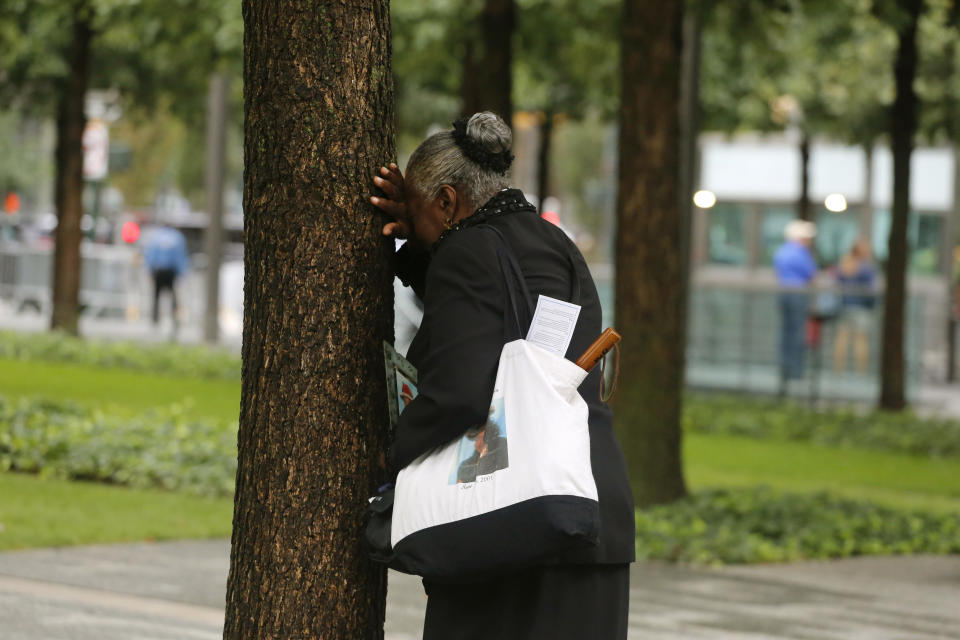 <p>A woman weeps by herself as she leans against a tree during a ceremony marking the 17th anniversary of the terrorist attacks on the United States. Tuesday, Sept. 11, 2018, at the World Trade Center in New York. (Photo: Mark Lennihan/AP) </p>