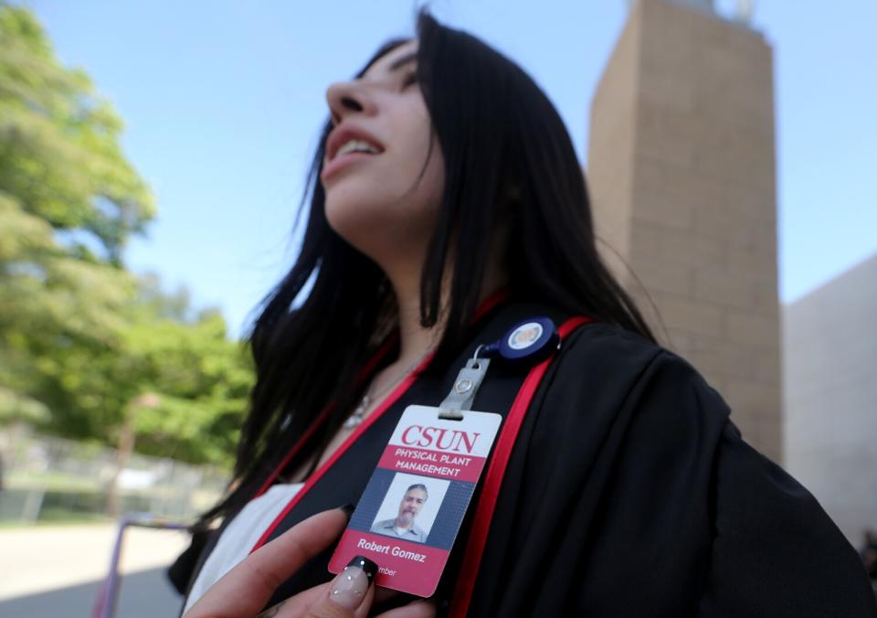 Audrie Gomez wears the employee badge of her father, Robert Gomez, an employee at Cal State Northridge.