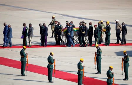 The body of former Zimbabwean President Robert Mugabe arrives back in Zimbabwe