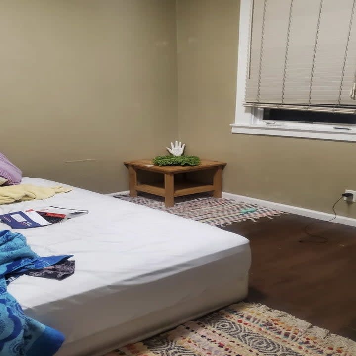 a photo of a bedroom and something is on the floor