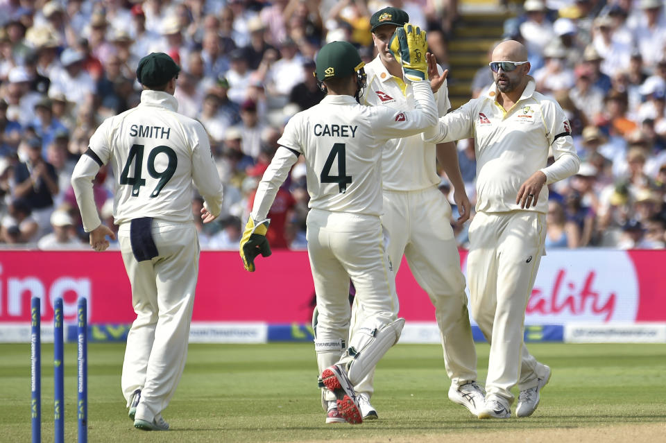 Australia's Nathan Lyon, right, celebrates after taking the wicket of England's Jonny Bairstow on day one of the first Ashes Test cricket match between England and Australia at Edgbaston, Birmingham, England, Friday, June 16, 2023. (AP Photo/Rui Vieira)