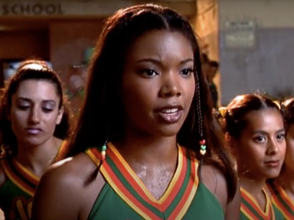 Gabrielle Union wearing a green cheer top in Bring It On