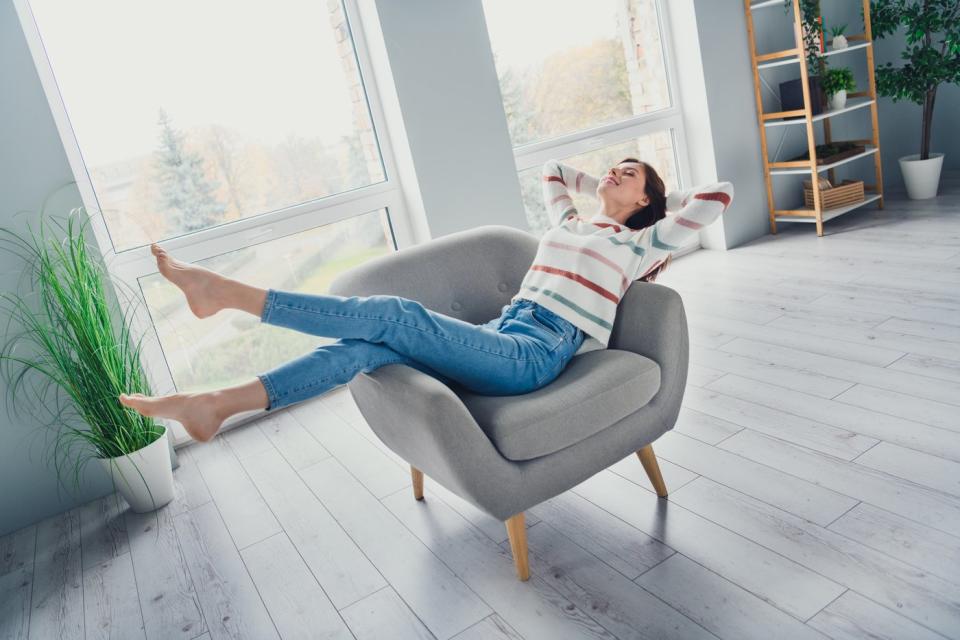 Person lounging in chair. 