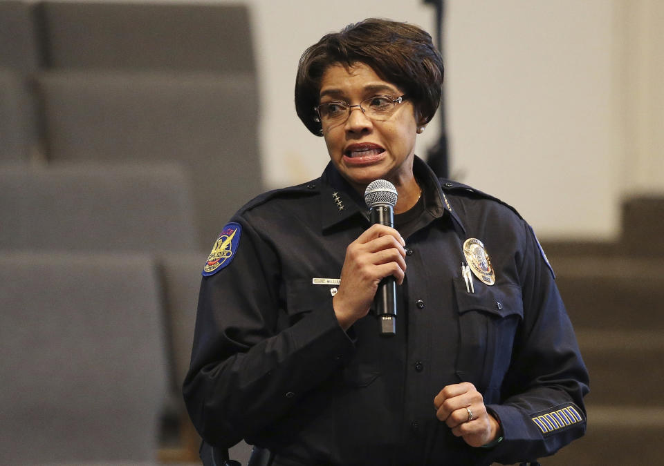 FILE - In this June 18, 2019, file photo, Phoenix Police Chief Jeri Williams addresses the audience at a community meeting in Phoenix. The meeting stemmed from reaction to a videotaped encounter that surfaced of Phoenix officers pointing guns and yelling obscenities at a black family they suspected of shoplifting. The Phoenix Police Department says it will train officers to track when they point their guns at people. The department announced Friday, Aug. 2 the policy was recommended by the Community Police Trust Initiative and the National Police Foundation, which studied last year's police shootings in the city. The policy will go into effect Aug. 19. (AP Photo/Ross D. Franklin, File)