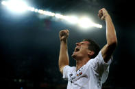 L'VIV, UKRAINE - JUNE 09: Mario Gomez of Germany celebrates scoring their first goal during the UEFA EURO 2012 group B match between Germany and Portugal at Arena Lviv on June 9, 2012 in L'viv, Ukraine. (Photo by Joern Pollex/Getty Images)