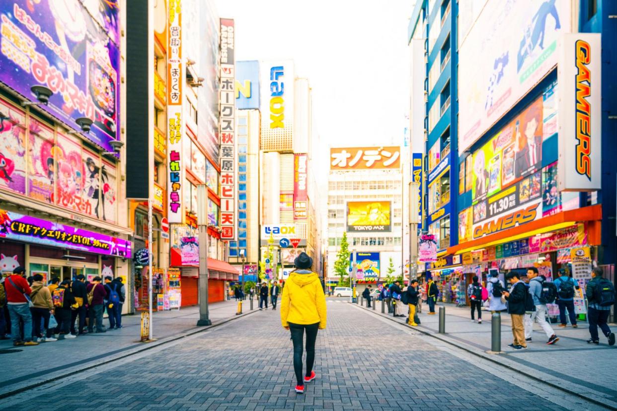 tourist walking through streets in Tokyo Japan