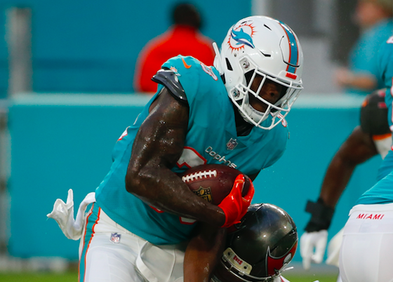 Kalen Ballage was thrown out of the huddle by Ryan Tannehill after missing a block. (AP Photo)