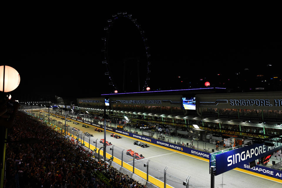 SINGAPORE STREET CIRCUIT, SINGAPORE - SEPTEMBER 22: Charles Leclerc, Ferrari SF90, and Lewis Hamilton, Mercedes AMG F1 W10, lead the field away at the start during the Singapore GP at Singapore Street Circuit on September 22, 2019 in Singapore Street Circuit, Singapore. (Photo by Mark Sutton / Sutton Images)