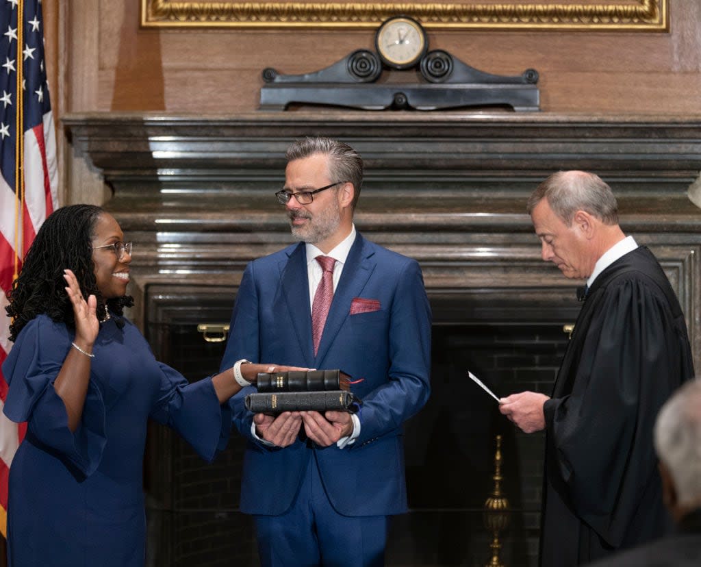 In this handout provided by the Supreme Court, Chief Justice John G. Roberts, Jr., right, administers the Constitutional Oath to Judge Ketanji Brown Jackson in the West Conference Room of the Supreme Court on June 30, 2022, in Washington, D.C. (Photo by Fred Schilling/Collection of the Supreme Court of the United States via Getty Images)