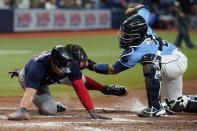 Tampa Bay Rays catcher Francisco Mejia (28) tags out Boston Red Sox's Hunter Renfroe (10) at home while trying to score on a single by Christian Vazquez during the seventh inning of a baseball game Thursday, June 24, 2021, in St. Petersburg, Fla. (AP Photo/Chris O'Meara)