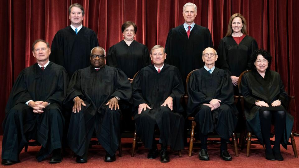 FILE - Members of the Supreme Court pose for a group photo at the Supreme Court in Washington, April 23, 2021. Seated from left are Associate Justice Samuel Alito, Associate Justice Clarence Thomas, Chief Justice John Roberts, Associate Justice Stephen Breyer and Associate Justice Sonia Sotomayor, Standing from left are Associate Justice Brett Kavanaugh, Associate Justice Elena Kagan, Associate Justice Neil Gorsuch and Associate Justice Amy Coney Barrett. The Supreme Court has ended constitutional protections for abortion that had been in place nearly 50 years — a decision by its conservative majority to overturn the court's landmark abortion cases. (Erin Schaff/The New York Times via AP, Pool, File)