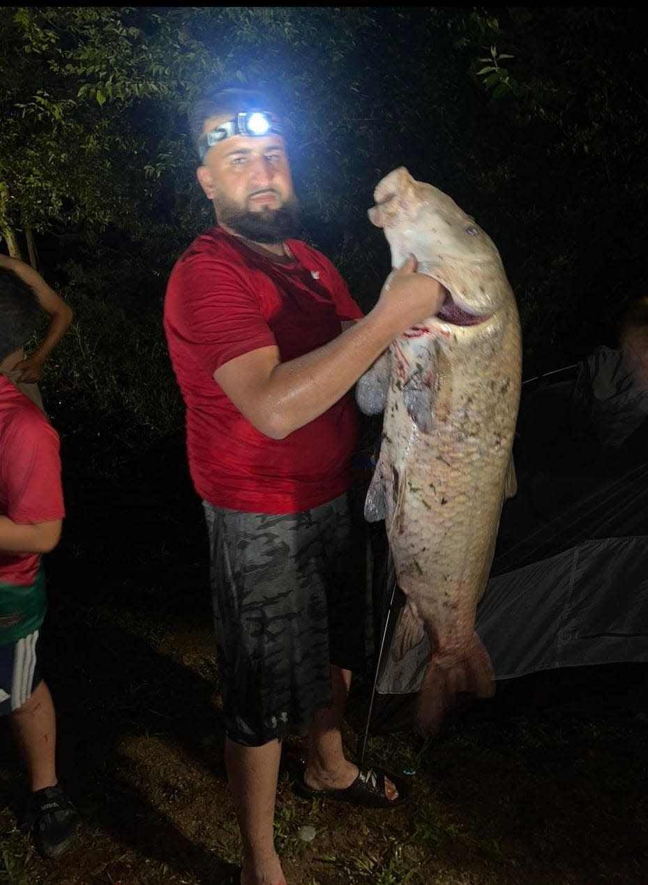 Derhat Mohammed was fishing at Percy Priest Lake when he caught what biologists believe to be either a smallmouth buffalo or black buffalo fish weighing in atover 76 pounds.