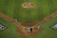 Tampa Bay Rays' Manuel Margot is tagged out at home by Los Angeles Dodgers catcher Austin Barnes trying to steal during the fourth inning in Game 5 of the baseball World Series Sunday, Oct. 25, 2020, in Arlington, Texas. (AP Photo/David J. Phillip)