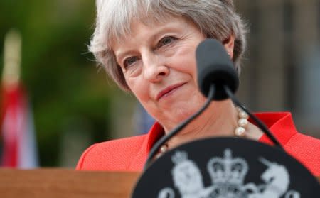 British Prime Minister Theresa May listens as she and U.S. President Donald Trump hold a press conference after their meeting at Chequers in Buckinghamshire, Britain July 13, 2018. REUTERS/Kevin Lamarque