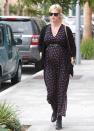 <p>January Jones belts her bump in a maxi sundress.</p>