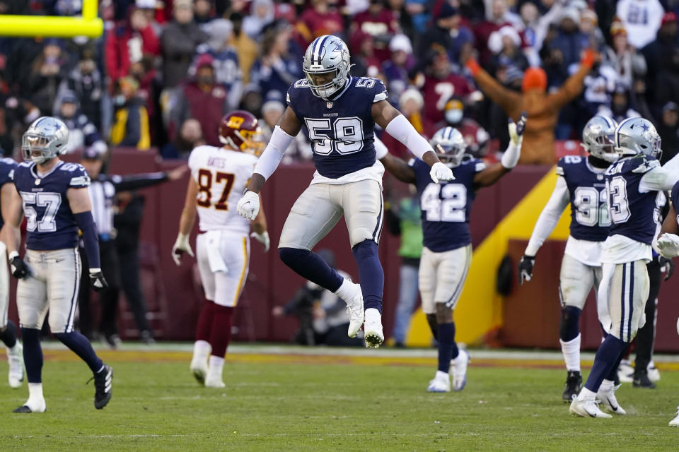 Dallas Cowboys defensive end Chauncey Golston (59) leaps up near the end of the second half of an NFL football game against the Washington Football Team, Sunday, Dec. 12, 2021, in Landover, Md. Dallas won 27-20. (AP Photo/Alex Brandon)