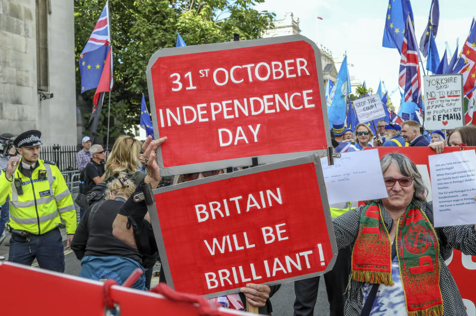 Pro Brexit demonstrators attend a protest at Parliament Square in London, Tuesday, Sept. 3, 2019. Lawmakers returned from their summer recess Tuesday for a pivotal day in British politics as they challenged Prime Minister Boris Johnson's insistence that the U.K. leave the European Union on Oct. 31, even without a withdrawal agreement to cushion the economic blow. (AP Photo/Vudi Xhymshiti)