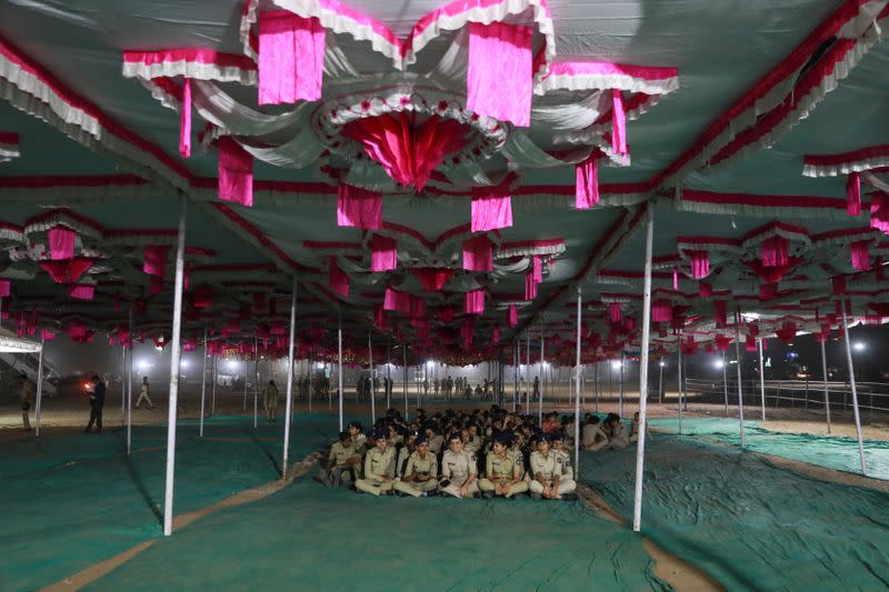 Policewomen wait inside a pandal at Sardar Vallabhbhai Patel International Airport, ahead of the President Donald Trump's visit in India Ahmedabad