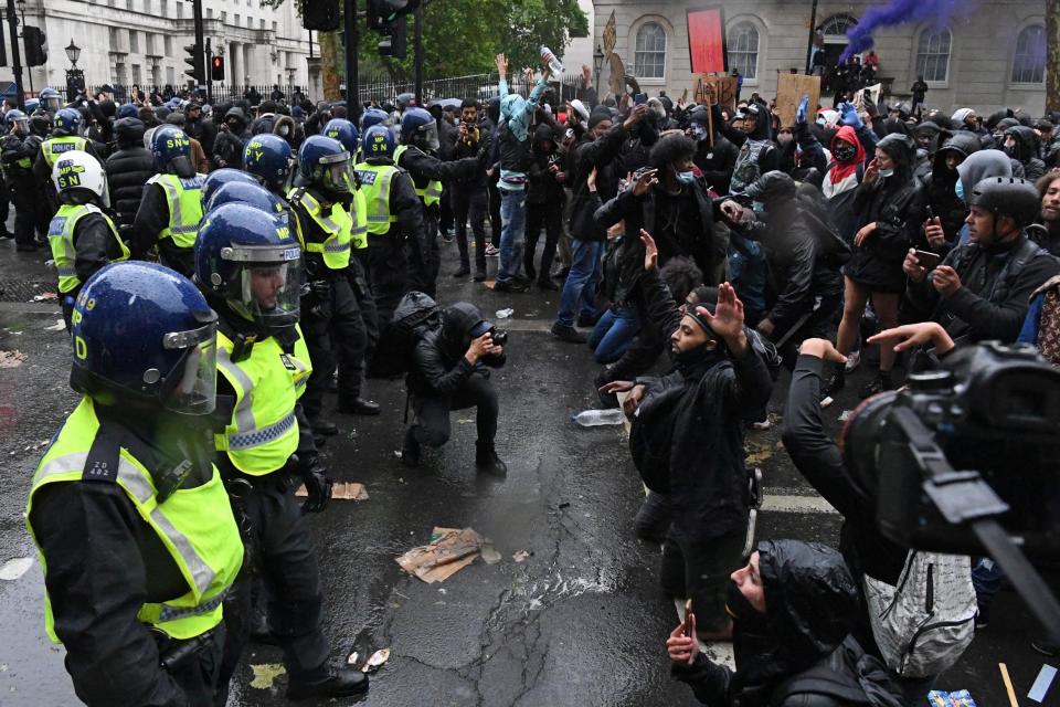 Police have formed a battle line with hundreds of protesters (AFP via Getty Images)