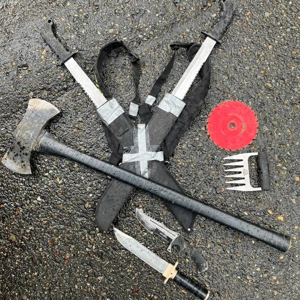 In addition to the ax, the suspect had what Olympia police described as “two large fixed-blade knives, a saw blade, a metal claw and two hunting knives.”