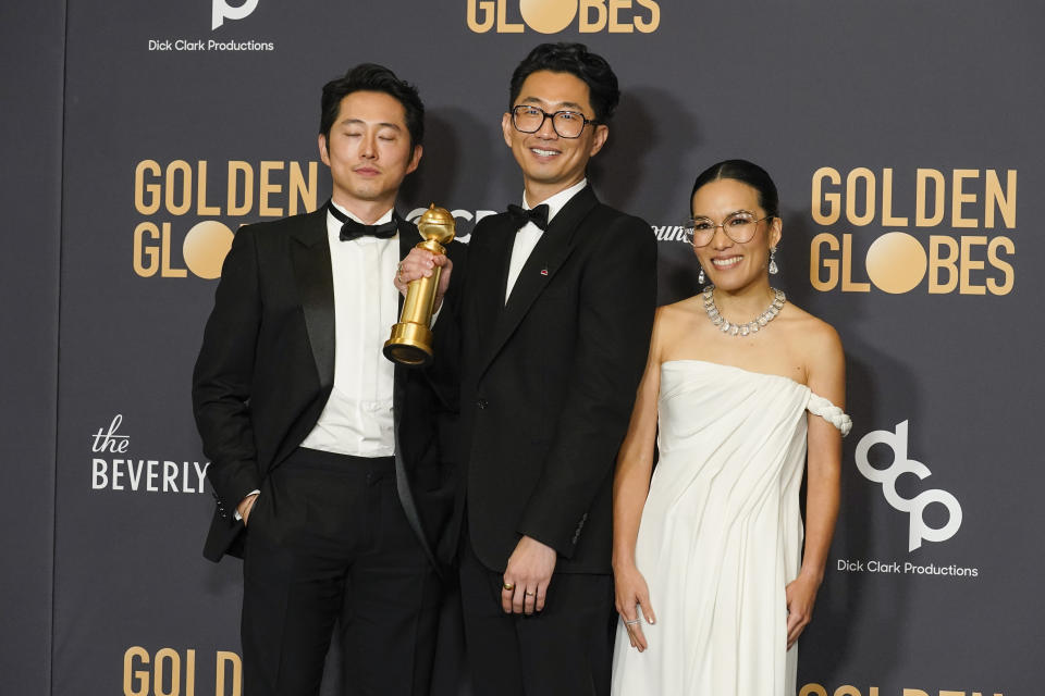 Steve Yeun, from left, Lee Sung Jin, and Ali Wong pose in the press room with the award for best television limited series, anthology series or motion picture made for television for "Beef" at the 81st Golden Globe Awards on Sunday, Jan. 7, 2024, at the Beverly Hilton in Beverly Hills, Calif. (AP Photo/Chris Pizzello)