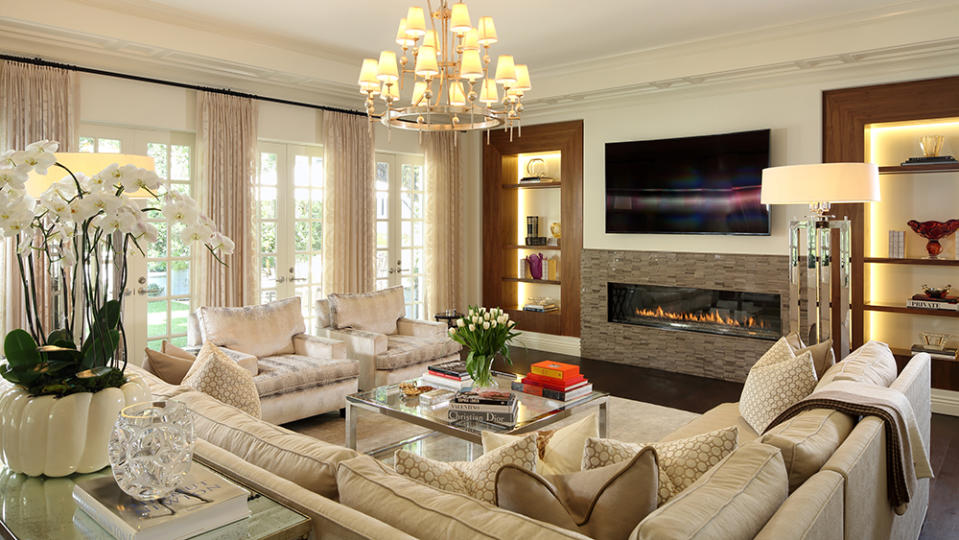 One of the living rooms in the home with a fireplace. - Credit: Michael McNamara/Sotheby’s International Realty