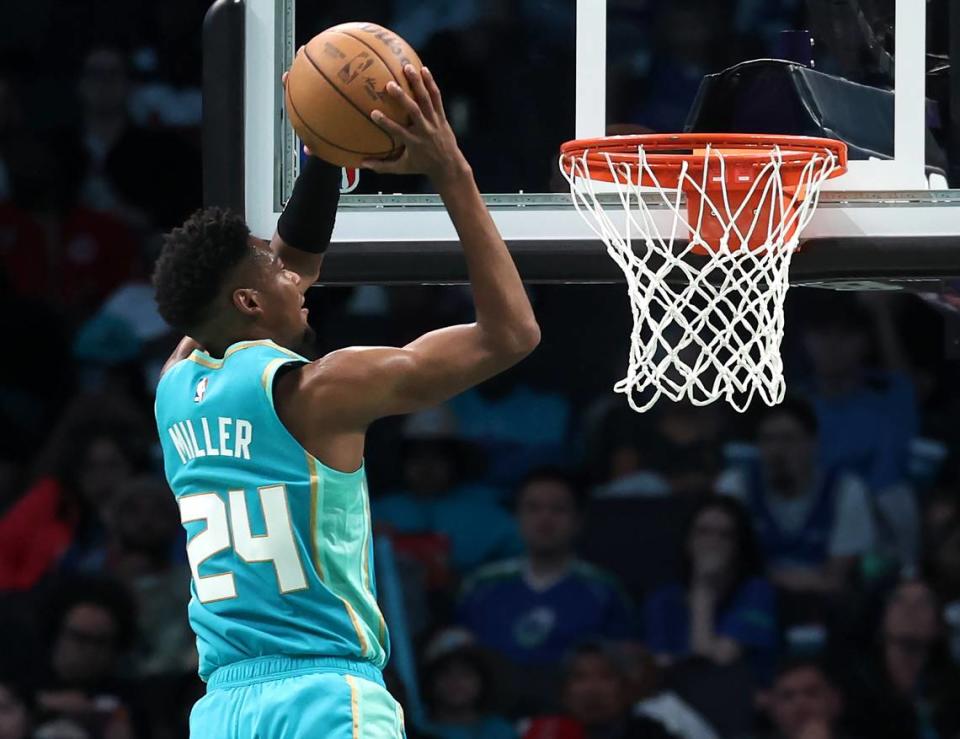 Charlotte Hornets forward/guard Brandon Miller drives to the basket for a two-handed dunk during second-half action against the Dallas Mavericks on Tuesday, April 9, 2024. The Mavericks defeated the Hornets 130-104.