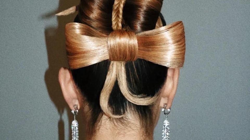 Lily James shares a picture of the back of her hair in a bow updo